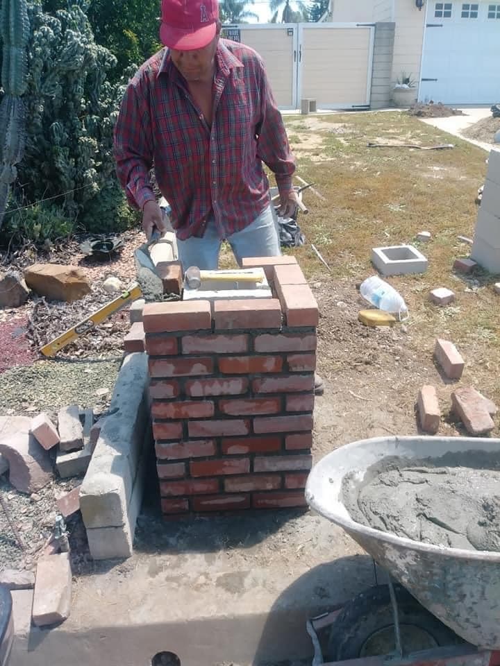 Brick column and masonry work in progress by Campos Lawn Care