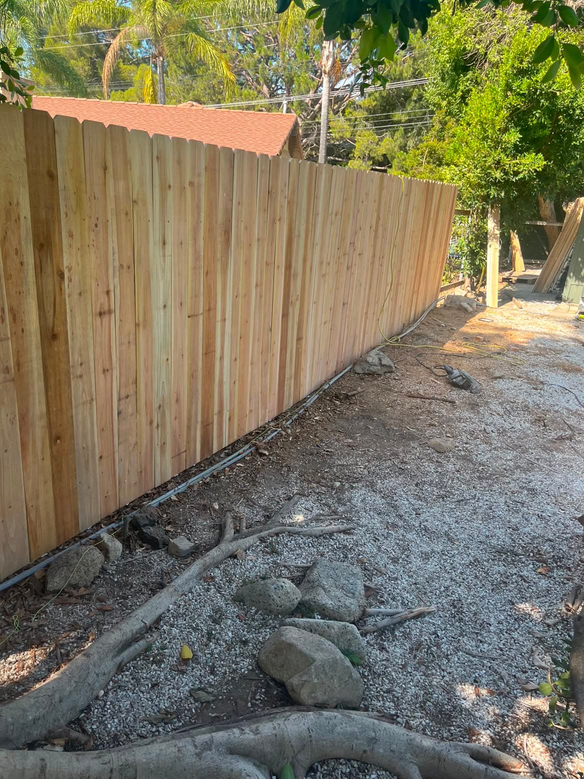 Completed wood privacy fence installed by Campos Lawn Care